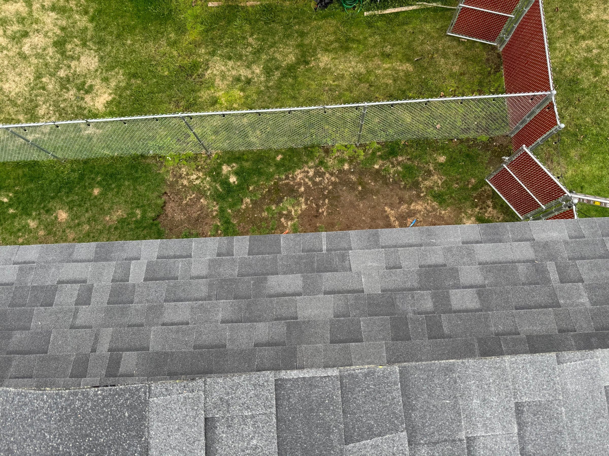 Aerial view of a finished commercial-scale shingle roof in Anchorage