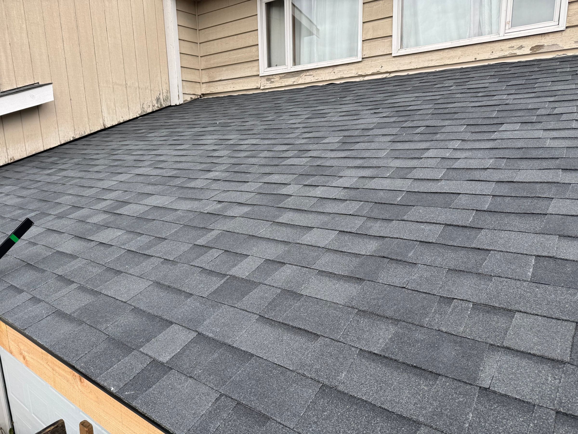 Long architectural shingle roof installation in Anchorage with pneumatic nail gun